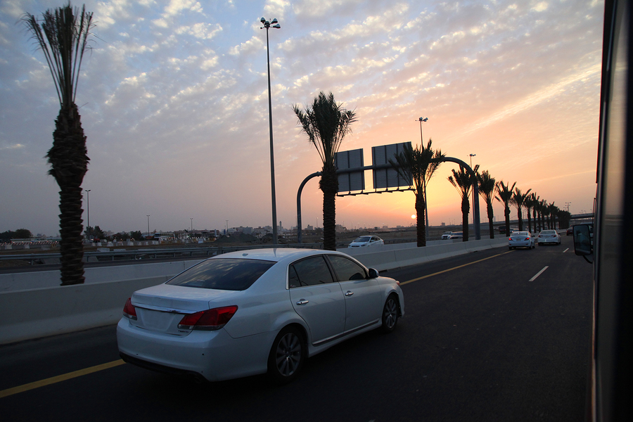 A car driving down a Saudi Arabian road