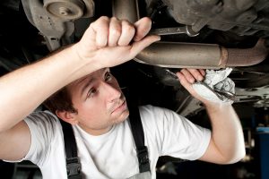 A mechanic working on a car