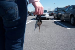 A person holding their keys