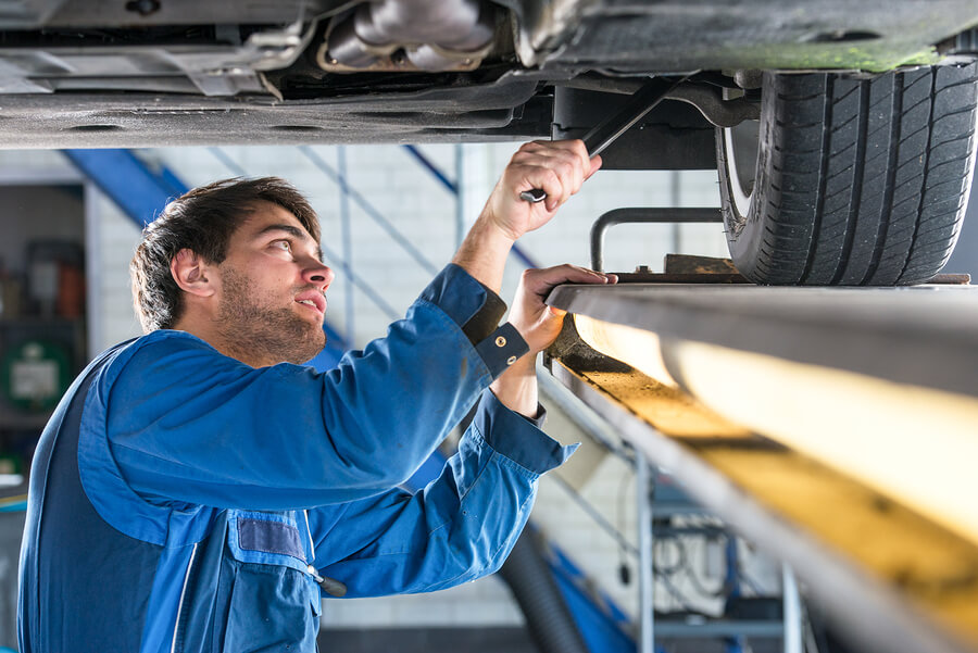 A mechanic working on a car