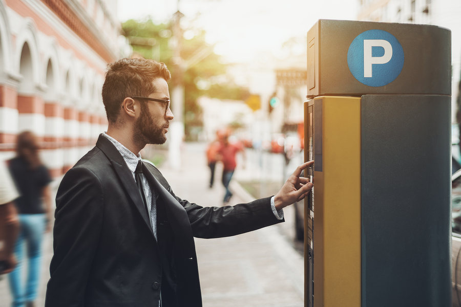 A person getting a parking ticket